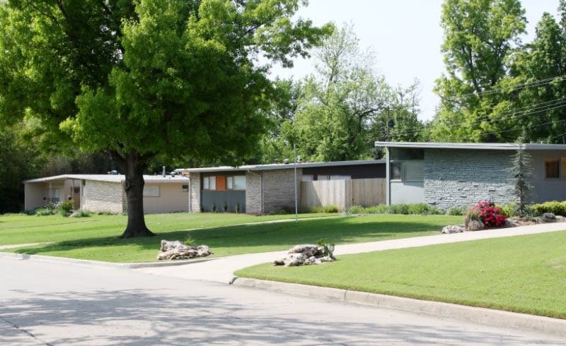 Three similar single-family mid century modern style rancher homes.