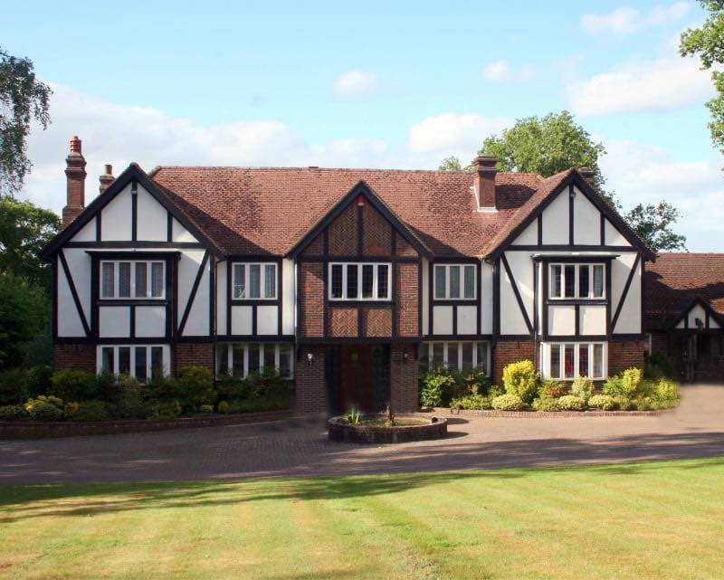 Single-family Tudor style home.